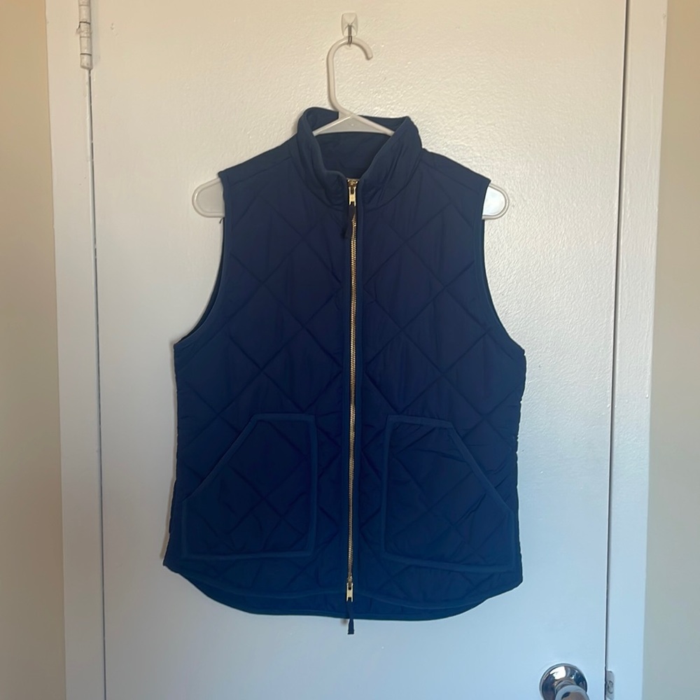 J Crew puffer vest in navy blue.